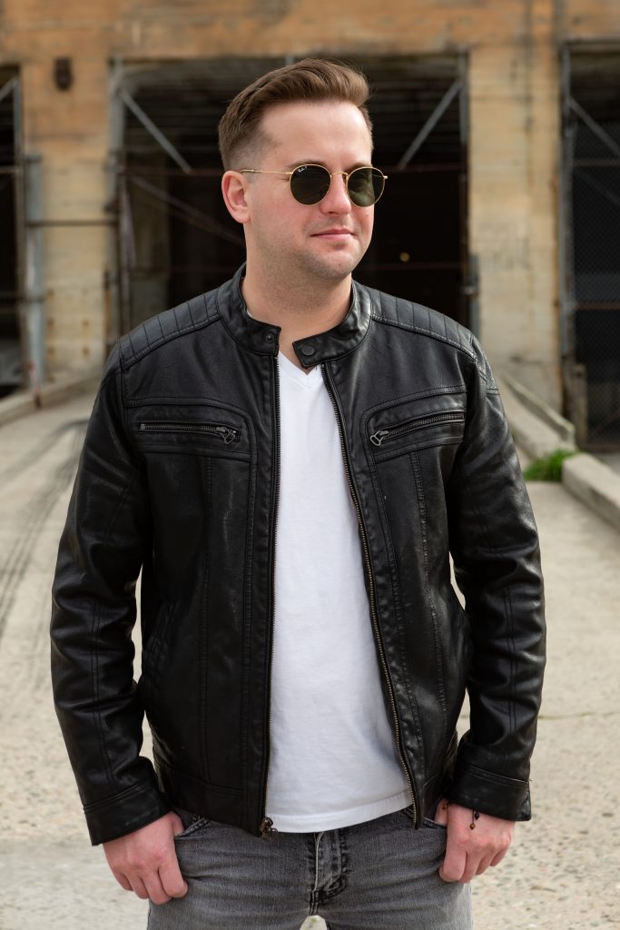Tyler Boone in a black leather jacket.