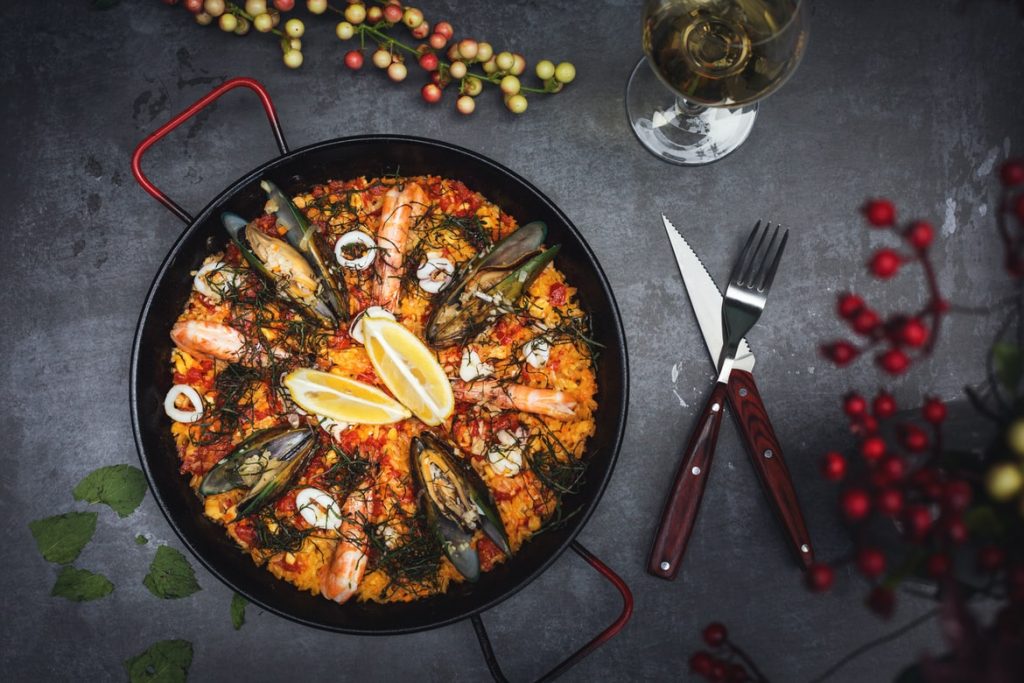 A seafood dish paired with a white wine.