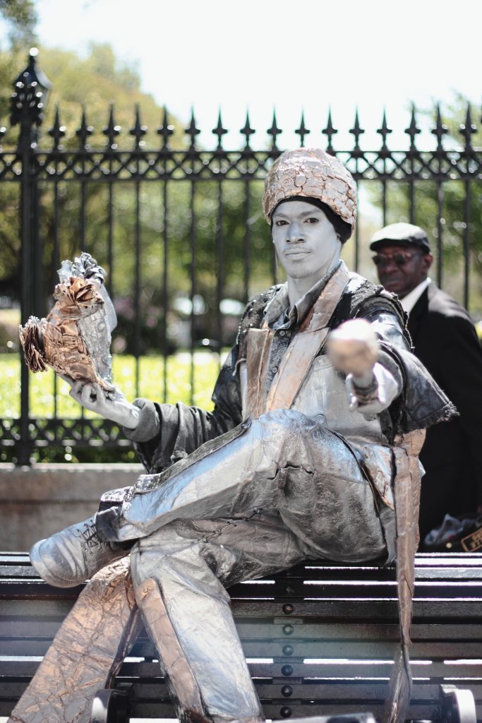 Street artist in New Orleans painted silver.