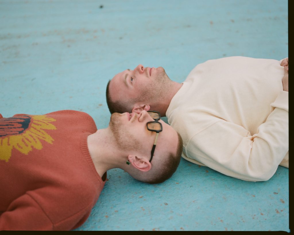 Miller Blue and Laurence Guy lying