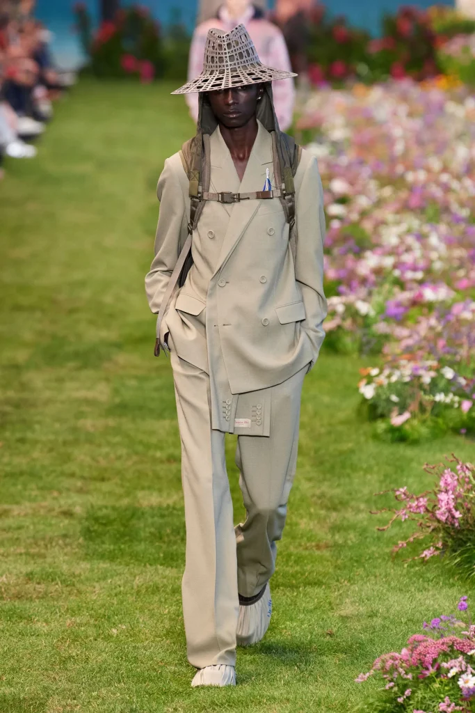 man wearing gardeners hat at Dior's garden