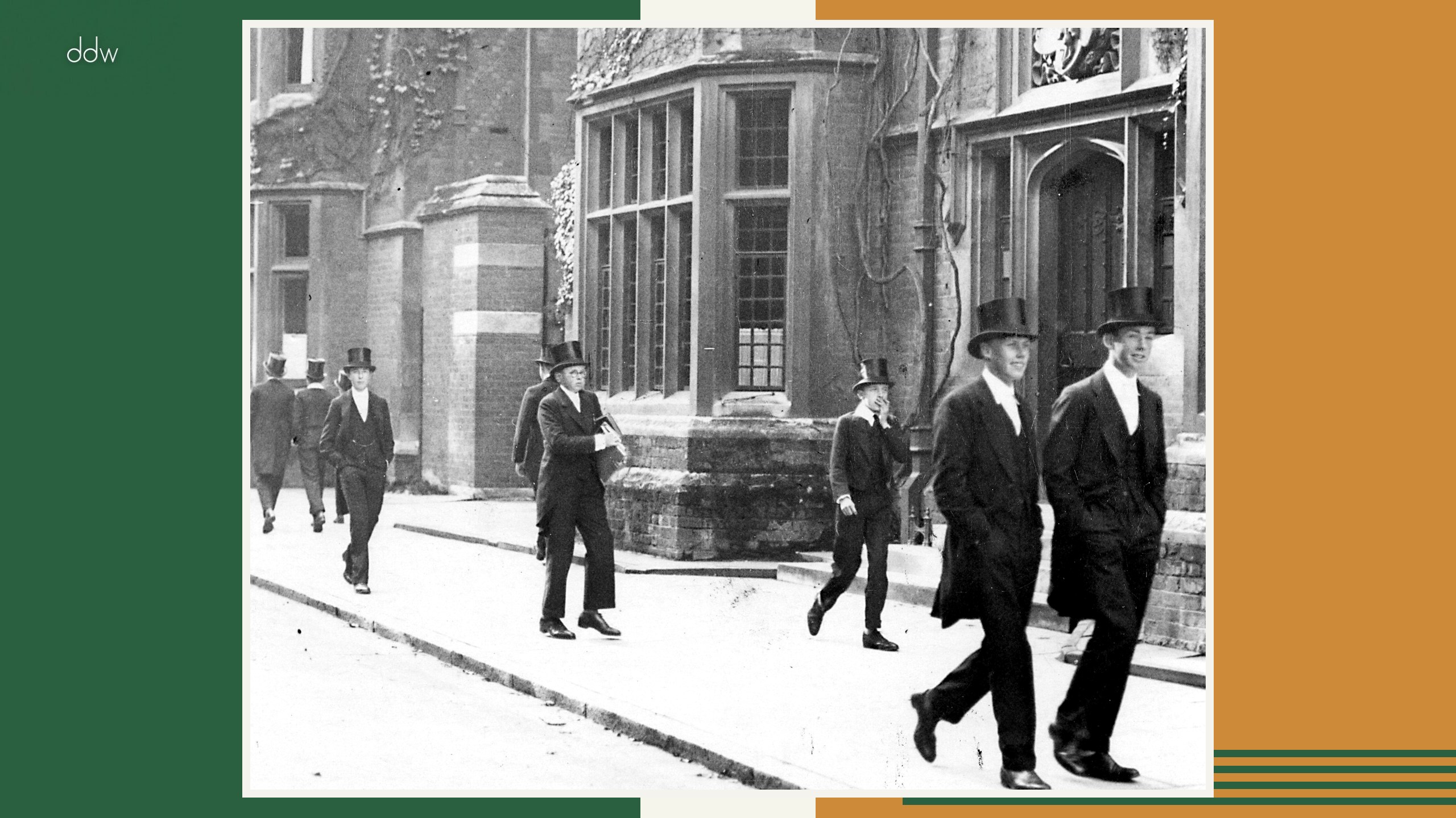 Eton schoolboys in tailcoats and top hats outside the college